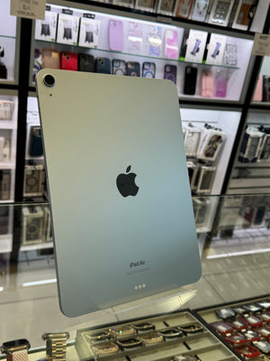 Silver iPad Pro on display in a store with blurred background