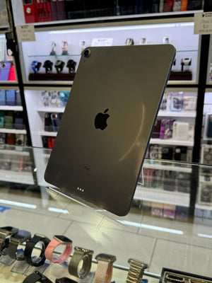 Black iPad Pro on display with a store interior in the background