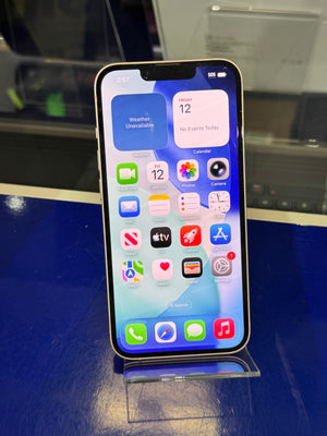 Smartphone displaying app icons on a reflective surface