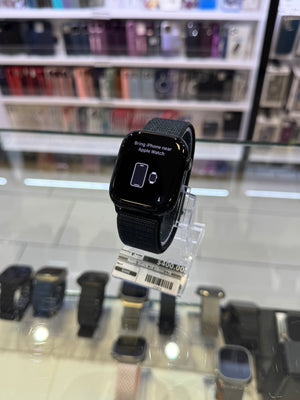 Black smartwatch on display with a clear background