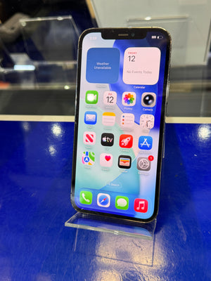 Smartphone with app icons displayed on a reflective surface