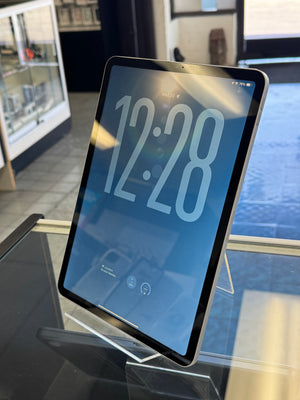 Digital clock displaying the time on an iPad on a stand