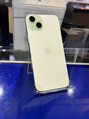 Green smartphone on a stand with a blurred background