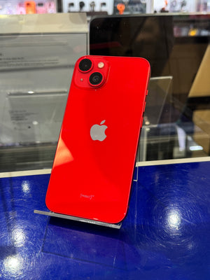 Red smartphone with Apple logo on a blue surface