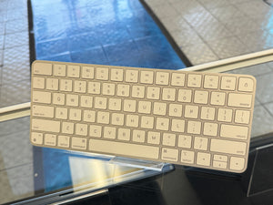 Apple keyboard on a reflective surface