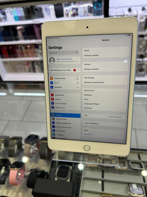 iPad displaying settings menu on a glass display stand in a store.