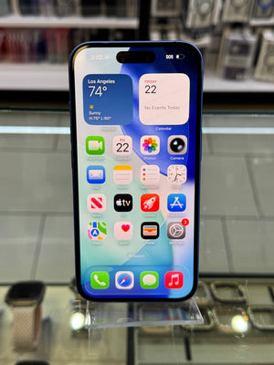 Smartphone with app icons displayed on a glass surface