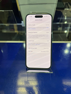 Smartphone displaying battery health information on a reflective surface