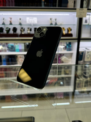 Black smartphone with Apple logo on a reflective surface