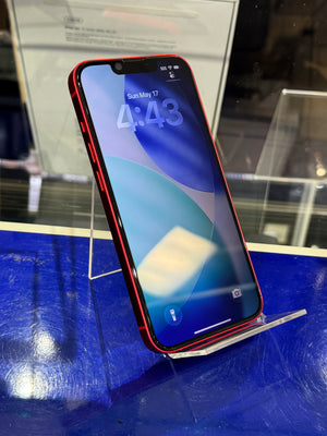 Smartphone with a blue screen on a reflective surface