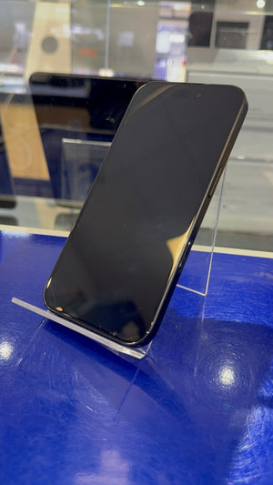 Black smartphone on a stand with a blurred background