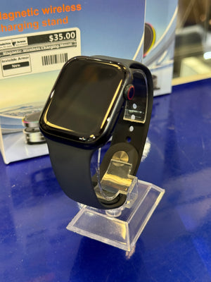 Smartwatch on a stand with a blue background