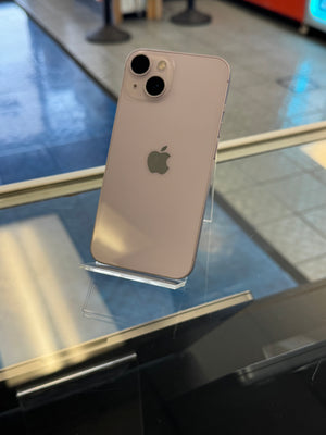 iPhone with Apple logo on a reflective surface