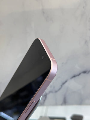 Close-up of a smartphone corner showing a black screen and a metallic rose gold frame against a light marble background.