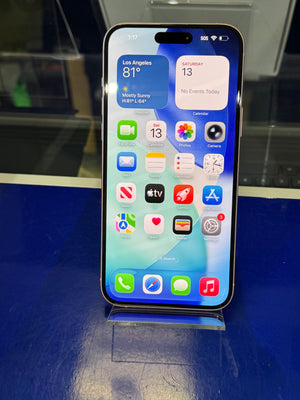 Smartphone with app icons displayed on a reflective surface
