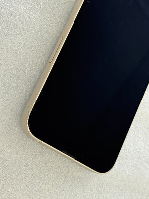 Close-up of a smartphone with a black screen on a light gray surface