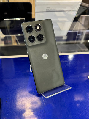 Green smartphone on a stand with a blurred background