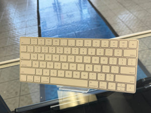 Beige keyboard on a reflective surface