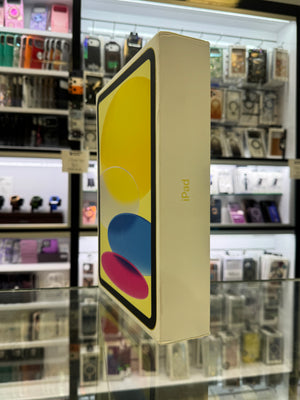 The side of an Apple iPad box resting on a glass shelf in a store setting. 