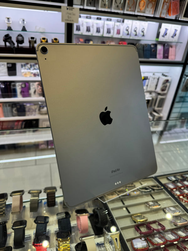 The back on an Apple iPad Air standing upright in a store setting 