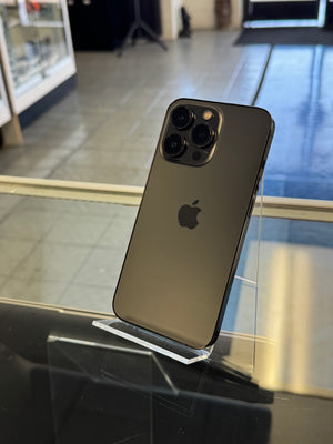 Smartphone with Apple logo on a reflective surface