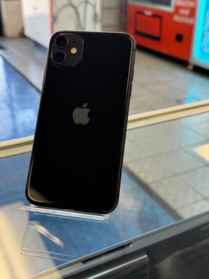 Black smartphone with Apple logo on a reflective surface
