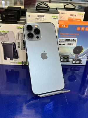 Silver iPhone on a stand with magnetic car mount packaging in the background