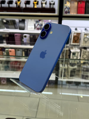 Blue iPhone with Apple logo on a clear stand in a store setting