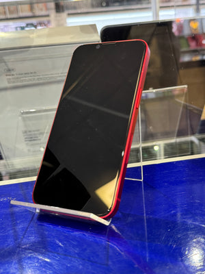 Smartphone with red border on a stand in a store setting