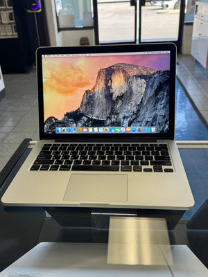 Open laptop with reflective screen in a modern office setting