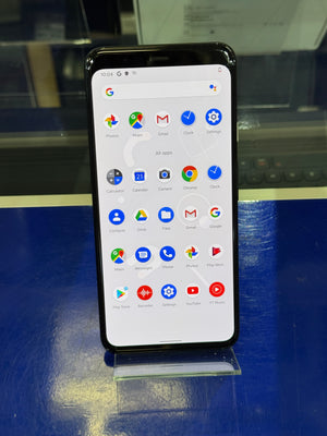 Smartphone with app icons displayed on a reflective surface