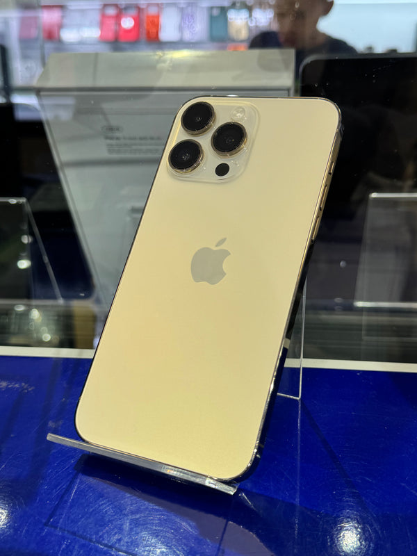 Gold iPhone 12 Pro Max on display with Apple logo