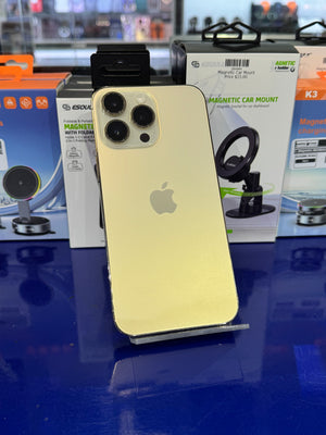 Apple smartphone with a magnetic car mount on a blue surface