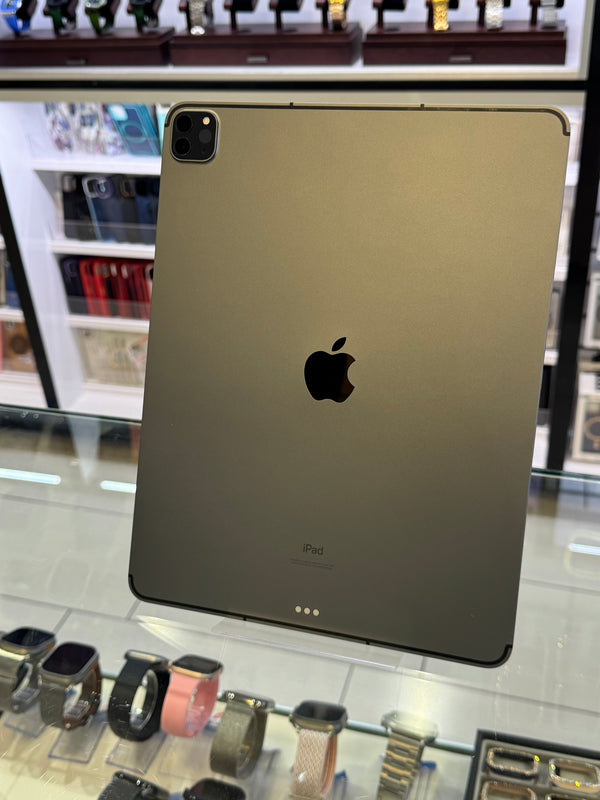 Apple iPad Pro with Apple logo on a reflective surface