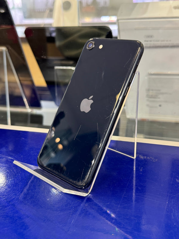 Black smartphone with Apple logo on a blue surface