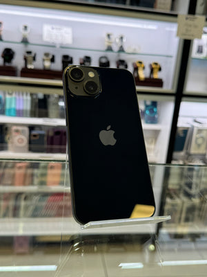 Black smartphone with Apple logo on a reflective surface