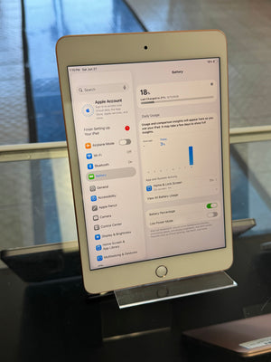 iPad displaying battery settings on a reflective surface
