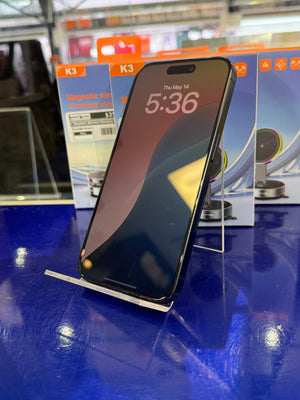 Smartphone on a stand with product packaging in the background