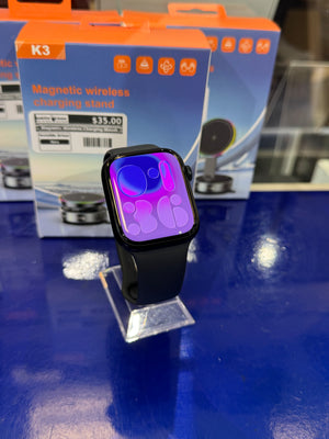 Smartwatch with a colorful display on a blue surface
