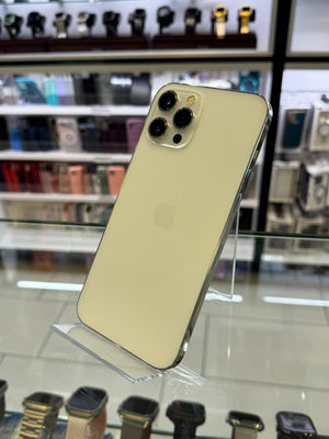 Gold smartphone on a stand with blurred store interior background