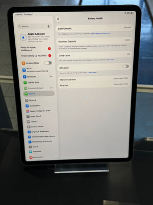 Tablet displaying a software interface with a blurred background