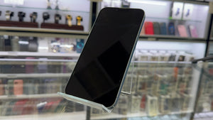 Smartphone on a glass surface in a store setting