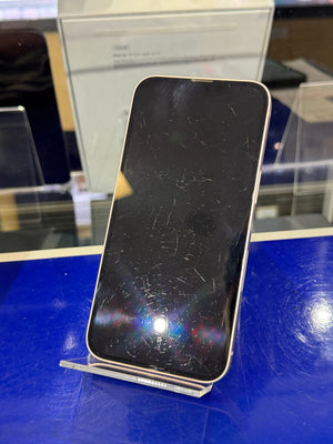 Smartphone with a scratched screen on a blue surface