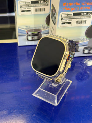 Smartwatch in clear plastic on a blue surface with labels in the background