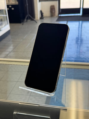 Smartphone held up against a glass display case