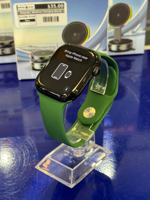 Smartwatch with a green band on a blue surface