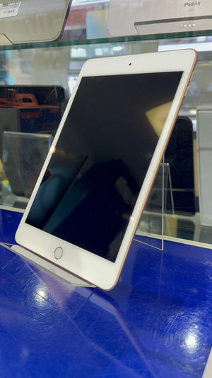 White tablet on a reflective surface with blurred background