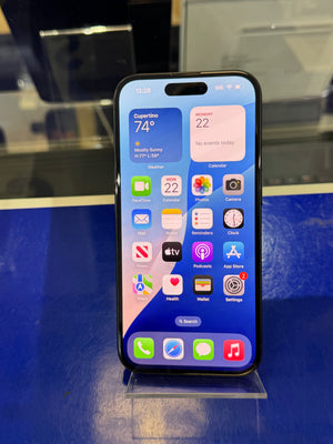 Smartphone displaying app icons on a reflective surface