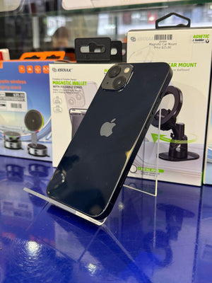 Black smartphone on a stand with car mount packaging in the background