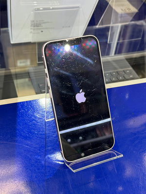 Smartphone with a scratched screen on a blue surface